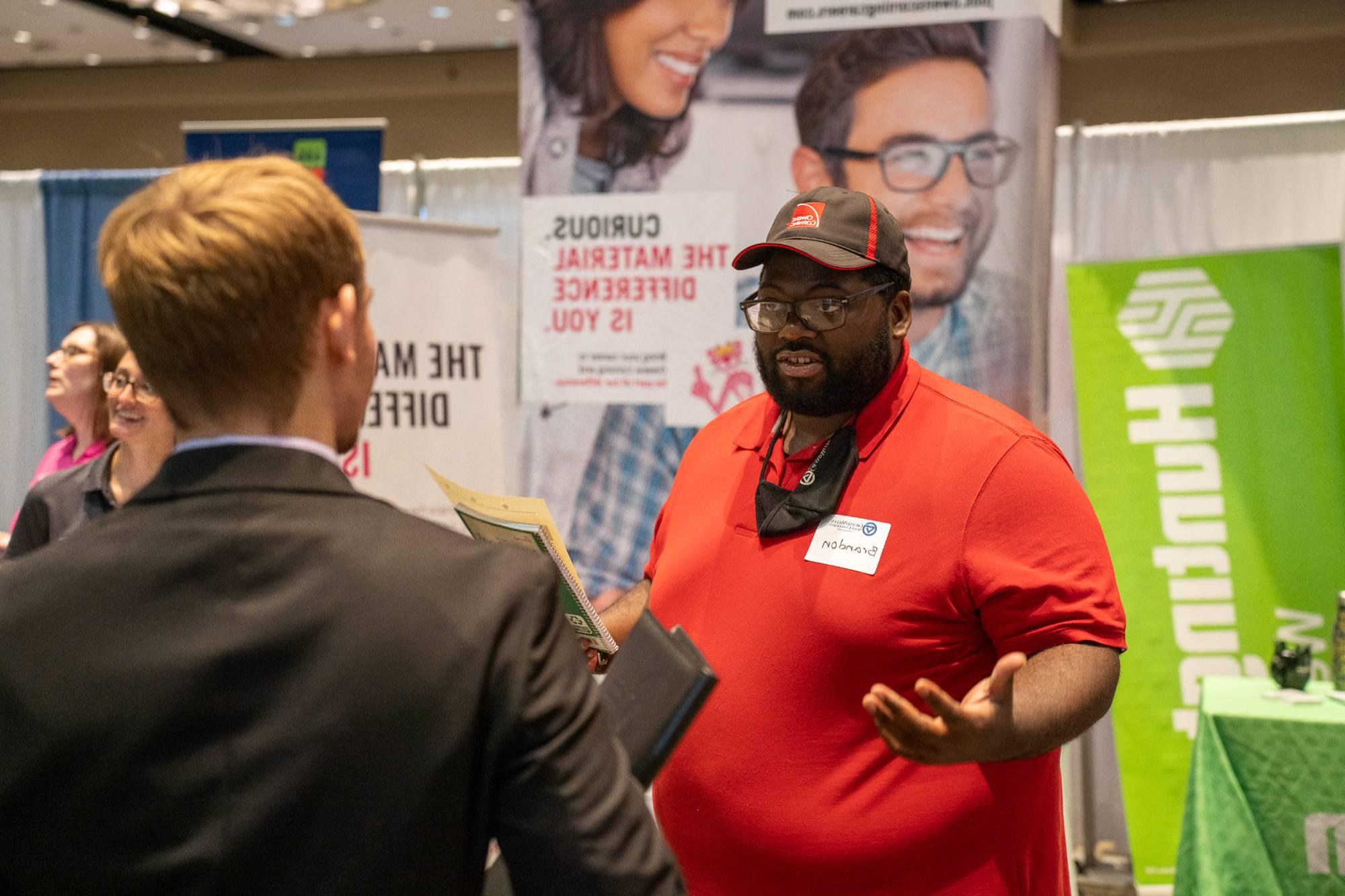 people speaking at career fair